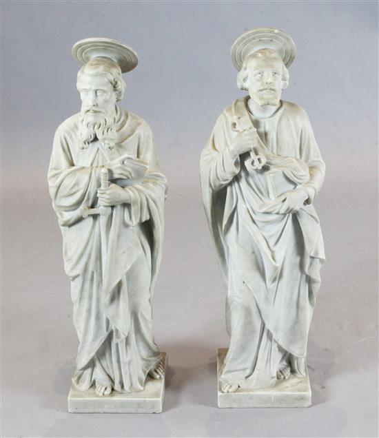 A pair of late 19th / early 20th century carved marble figures of St Peter and a Saint Paul holding a sword, H.30in.
